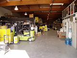 Arc warehouse with forklift and road cases